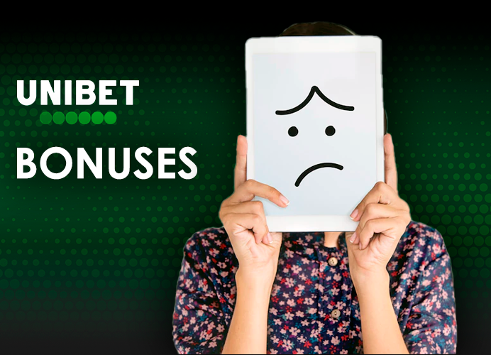 Someone is covering his face with a tablet with a sad smiley face and Unibet logo
